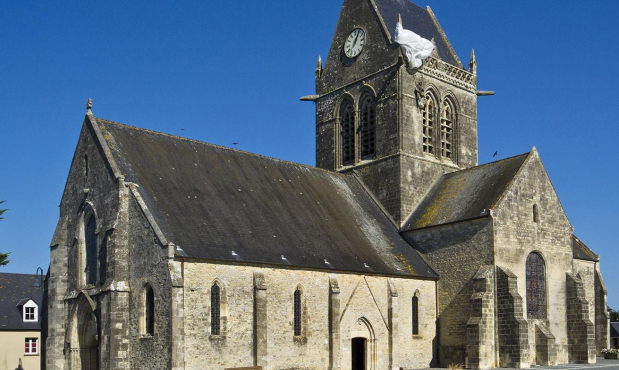 Normandy D-Day private luxury tour with In Luxe Travel France. Visit Sainte-Mere l'Eglise famous with John Steele paratrooper.